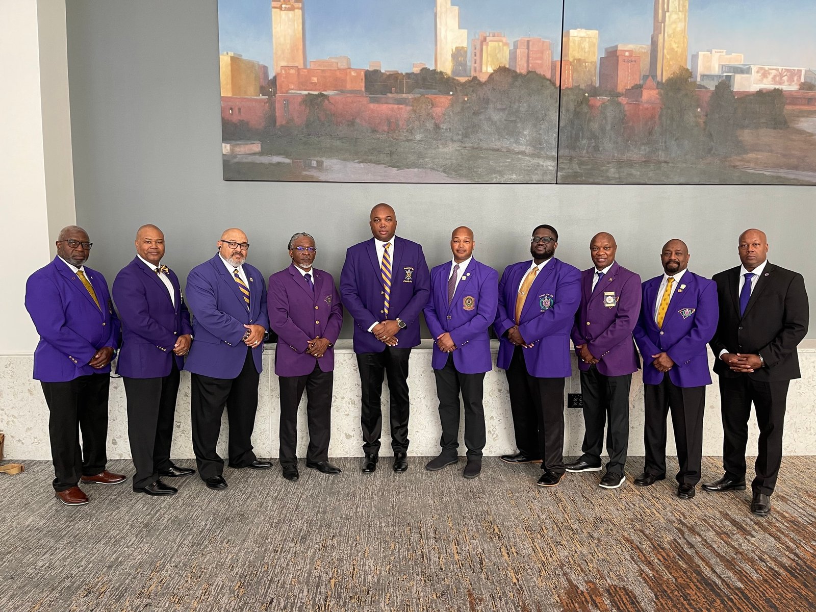 Capital City Ques gathered in purple blazers