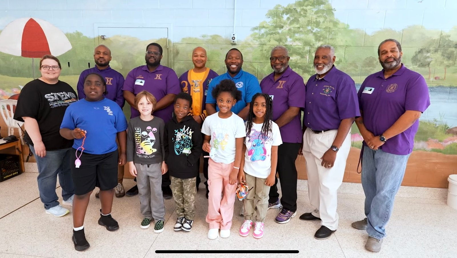 Chapter members with young participants at a community program